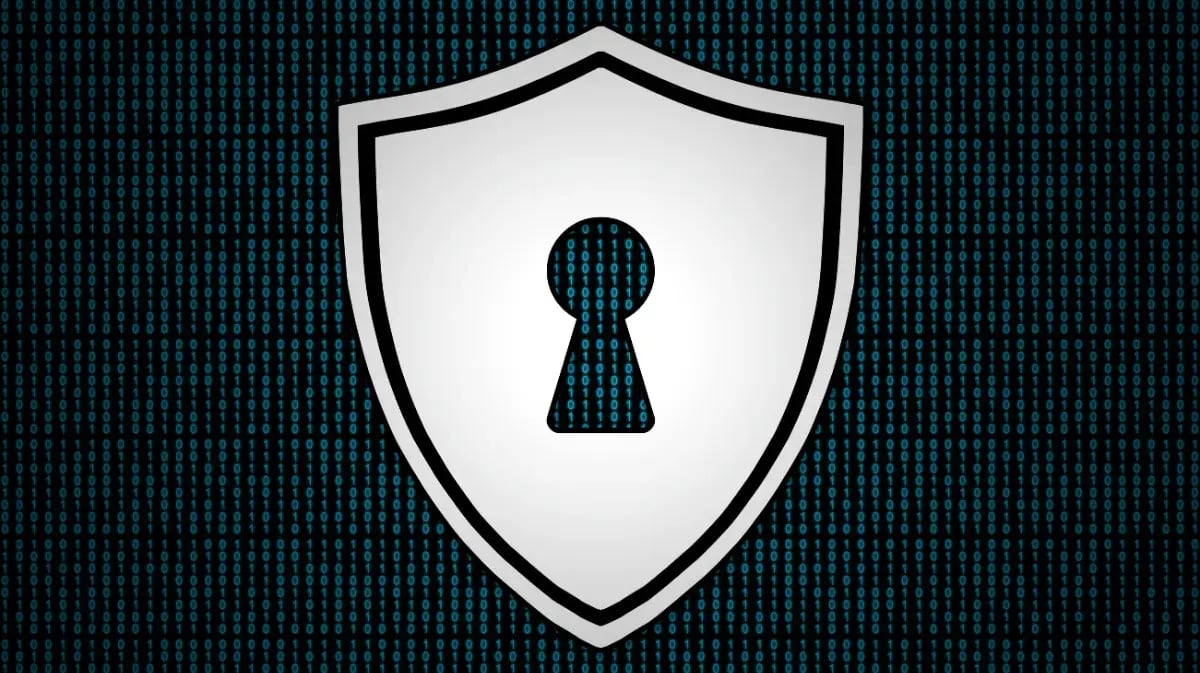 coding background with a shield and keyhole on it in the foreground