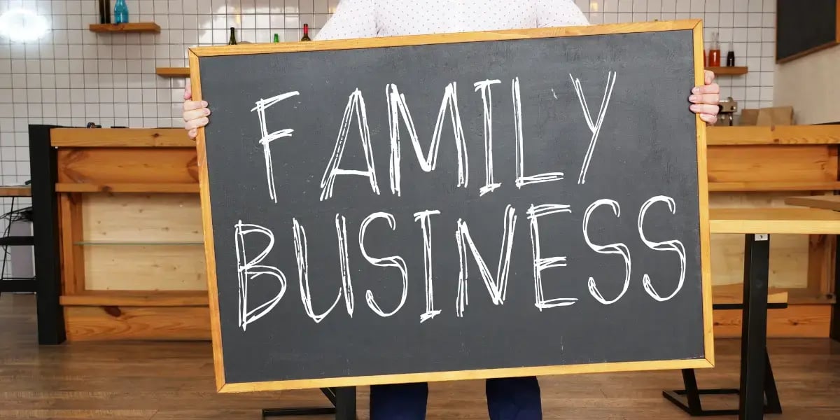 person standing with a sign that reads 