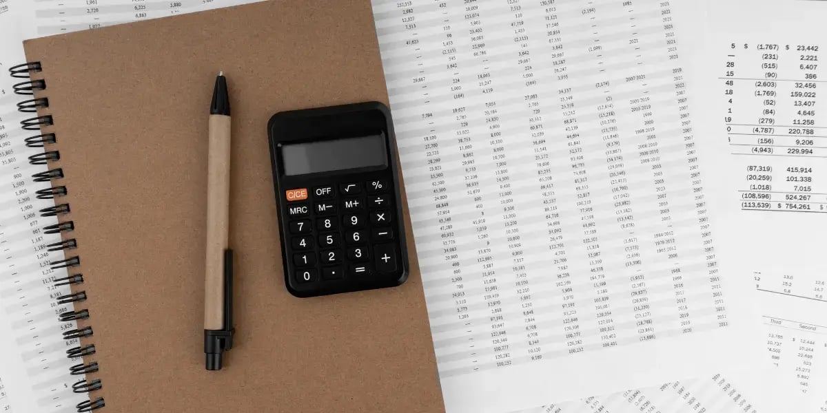 calculator on top of financial statements