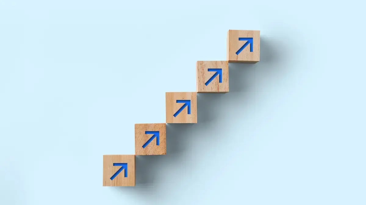 blue background with blocks and arrows pointing up