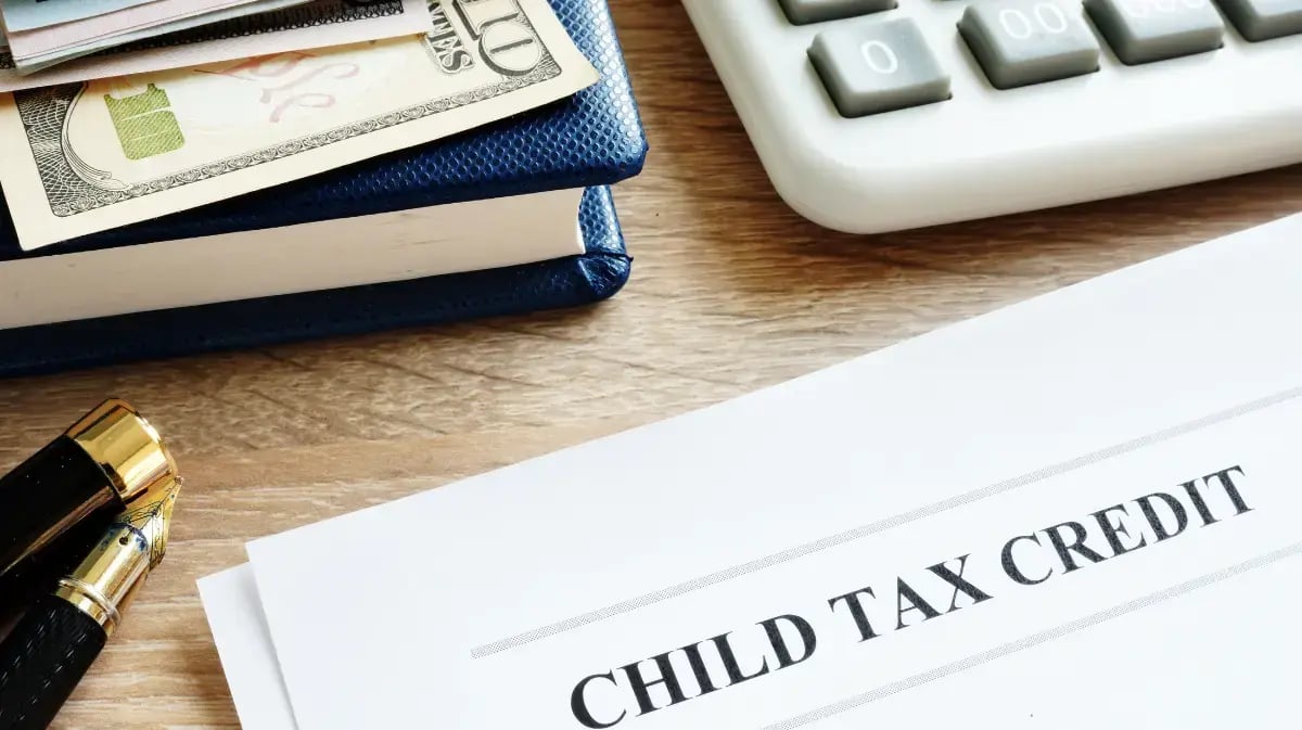 child tax credit document on desk with calculator