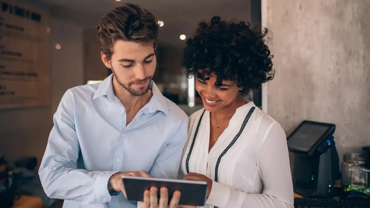 partners working together on a tablet