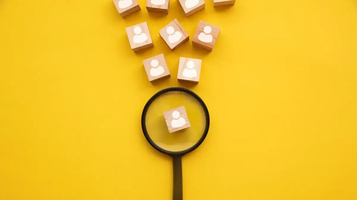 magnifying glass hovering over blocks with outlines on them