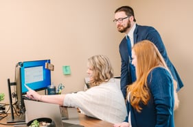 TMA Payroll employees going through a demonstration