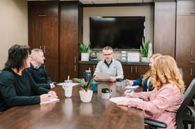 TMA employees meeting in conference room