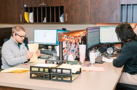 TMA employees working at their desks