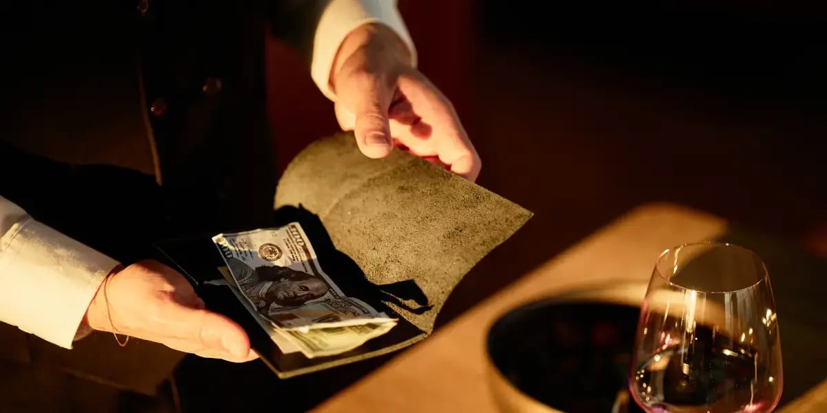 Restaurant employee collecting a tip