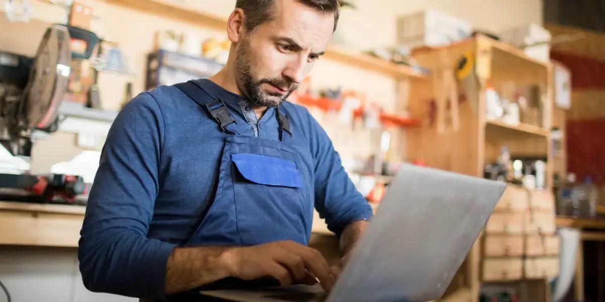 small business owner applying for business loan on his computer