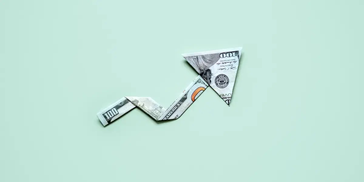 Arrow made from money pointing up