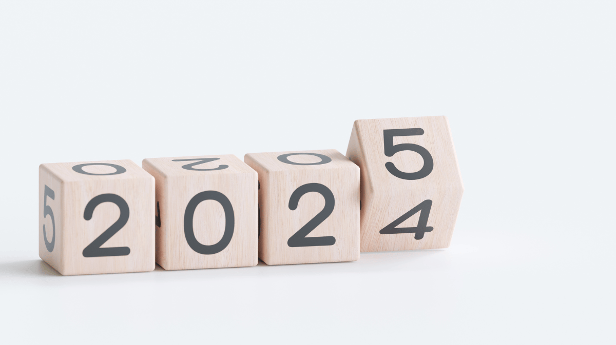 wooden blocks with the year on it, turning from 2024 to 2025