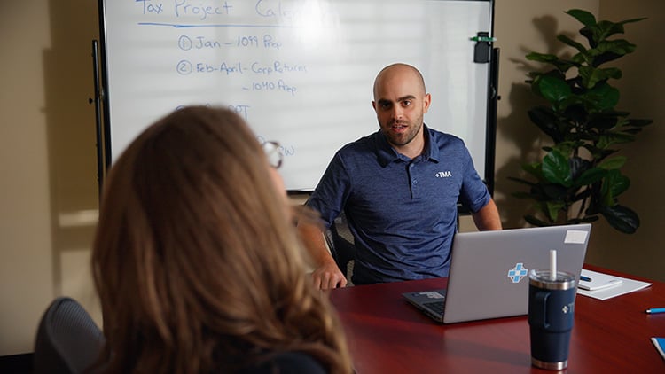 TMA Accounting tax manager in a meeting