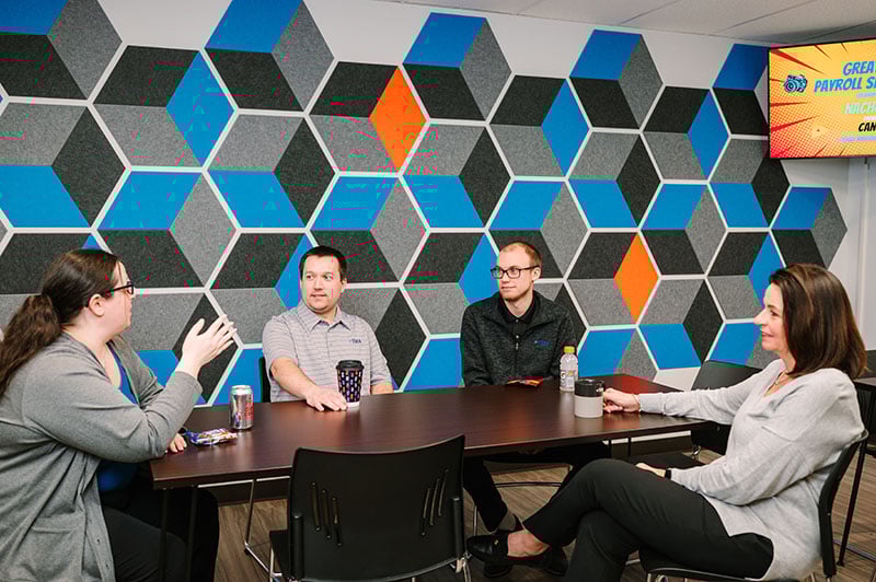 employees-in-kitchen-seated